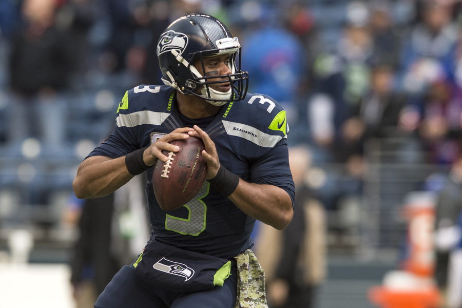 Seahawk quarterback Russell Wilson gets ready to throw down field against the Giants secondary on Sunday, Nov. 9, 2014 at Century Link Field.