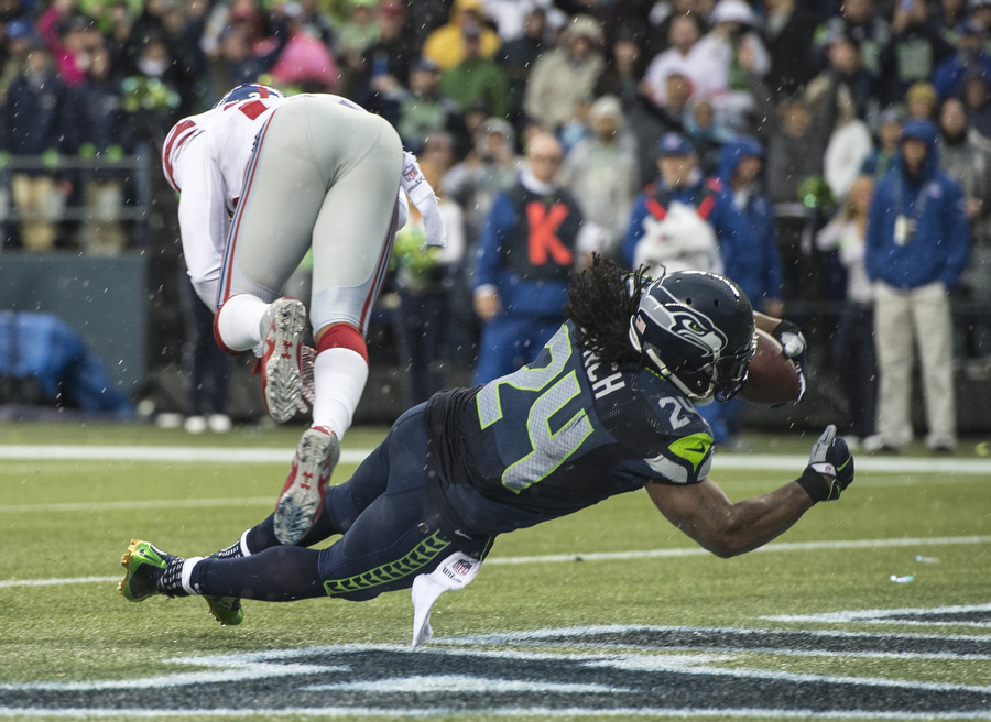Seattle Seahawk Marshawn Lynch on his way to one of his four touchdowns in the 38-17 win over the New York Giants on Sunday, Nov. 9, 2014 at CenturyLink Field.